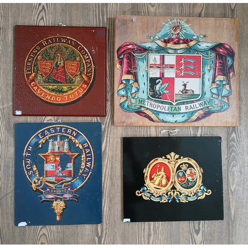 166 - A group of four reproduction railway themed insignias, printed and mounted on wooden boards.