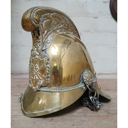 400 - A brass Merryweather fire helmet circa 1900.