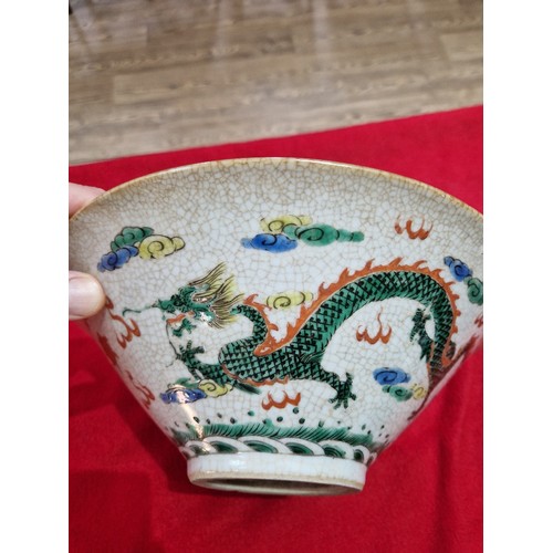 83 - A Chinese porcelain bowl, circa 1900, crackle glaze with over enamel decoration depicting figures to... 