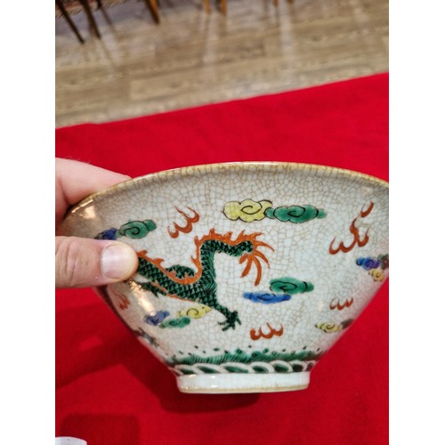 83 - A Chinese porcelain bowl, circa 1900, crackle glaze with over enamel decoration depicting figures to... 