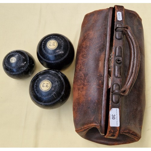 30 - A set of crown green bowls with jack in a vintage leather bag