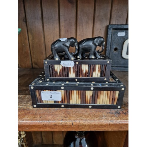 2 - Two porcupine quill boxes together with two carved wood elephants.