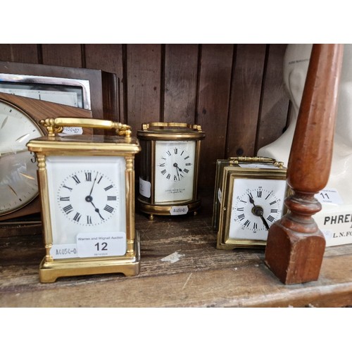 12 - Three brass carriage clocks including Gerrard & Co and one marked J Vincent.