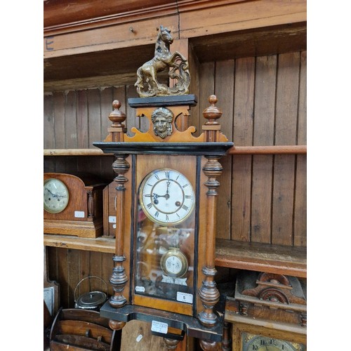 5 - A Junghans Vienna style wall clock with horse finial.