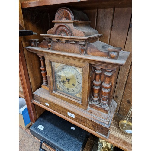 22 - A large oak mantle clock