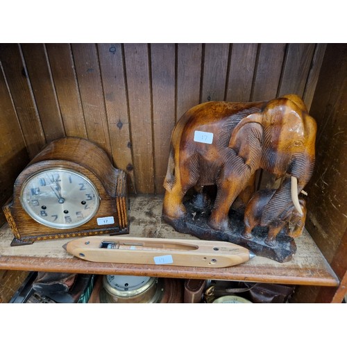 17 - A wooden carved elephant figure, mantle clock & a Crossley's spinning shuttle