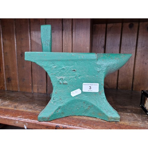 3 - A green painted cast iron last, length 27cm.