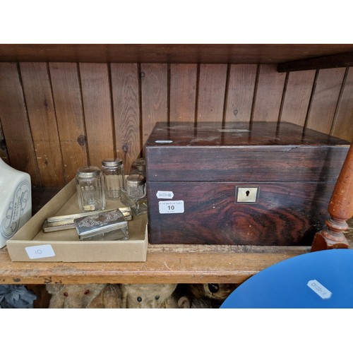 10 - A 19th century rosewood dressing box with fitted interior together with various glass containers.