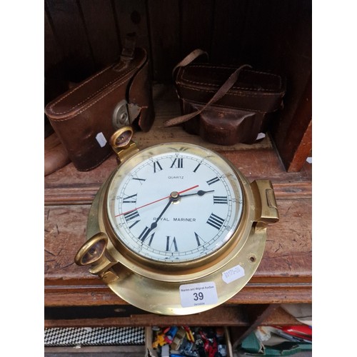 39 - Two vintage cameras and a brass bulkhead clock.