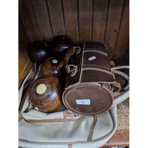 53 - Three sets of crown green bowls with two bags.