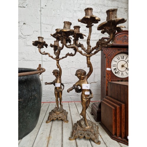 74 - A pair of cast brass candelabras