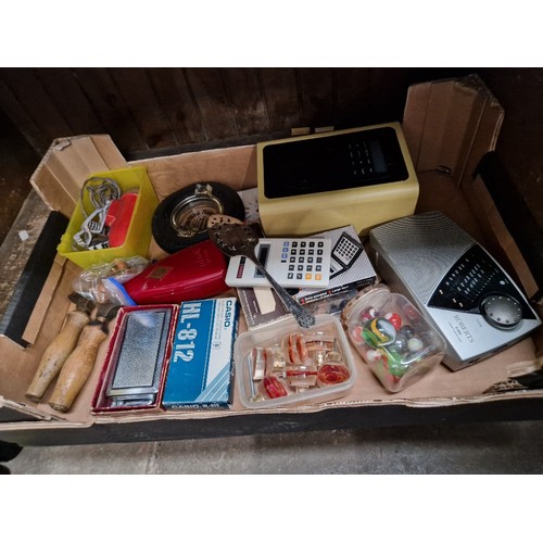 71 - A box of assorted collectables including a tyre ashtray, calculators, lighter, etc.