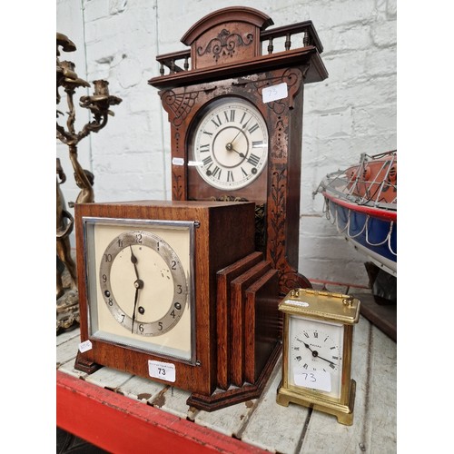 73 - An Art Deco oak cased mantle clock, an American shelf clock and a brass carriage clock.