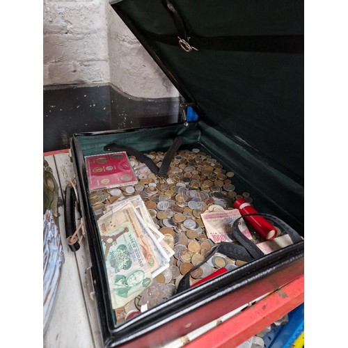 81 - A briefcase of assorted world coins & banknotes