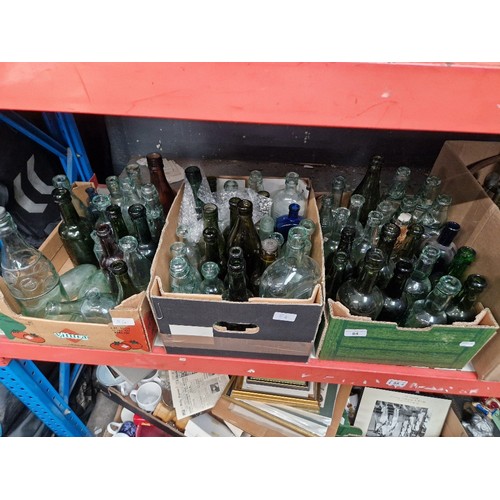 84 - Three boxes of Preston glass bottles.