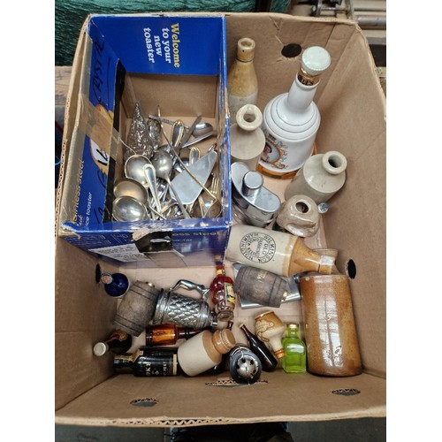 94 - A box containing various miniature alcoholic beverages, a full Bells Whisky ceramic decanter, variou... 