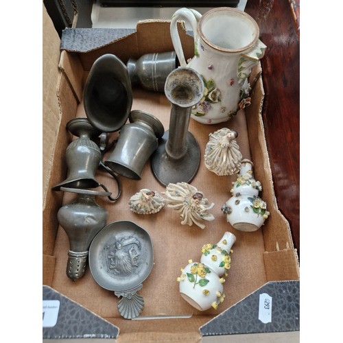 101 - A box of antique pewter and continental porcelain including crinoline ladies etc.