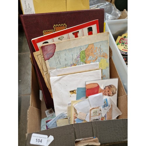 104 - A box of stamp albums and loose stamps and a box of prints