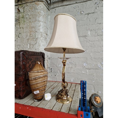 123 - A brass table lamp and a glass vase