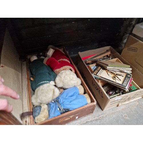 145 - A box of leather working tools and books etc