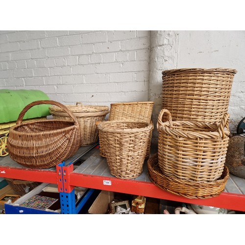 129 - 8 medium sized wicker baskets