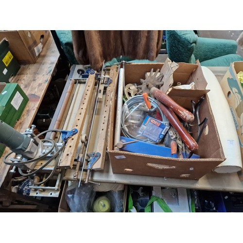 161 - A box containing various tools including sash clamp, flexible drain cleaner, vintage multi bladed sh... 