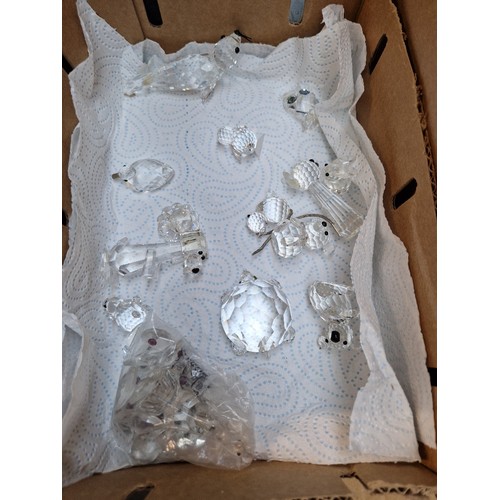 199 - A small box of 14 Swarovski figures - some have been repaired