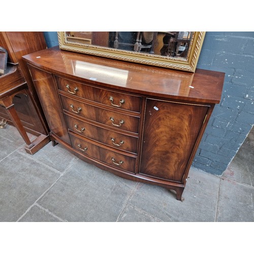 993 - A Bevan Funnell 'Reprodux' bow front mahogany sideboard.