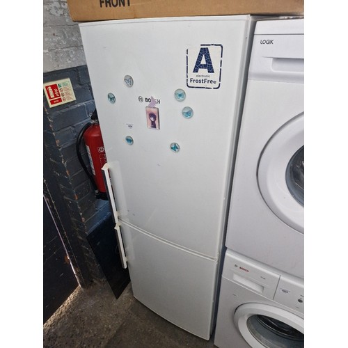 1024 - A Bosch Exxcel fridge freezer with 3 drawer freezer compartment