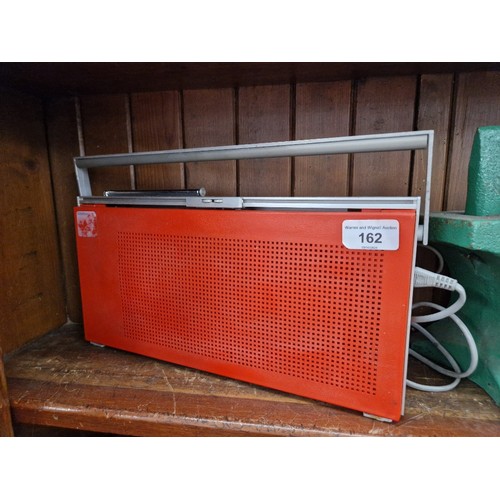 162 - A 1970s Bang & Olufsen Beolit 700 radio in red.