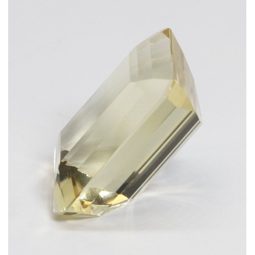 184 - An emerald cut loose yellow citrine weighing 25.5cts.