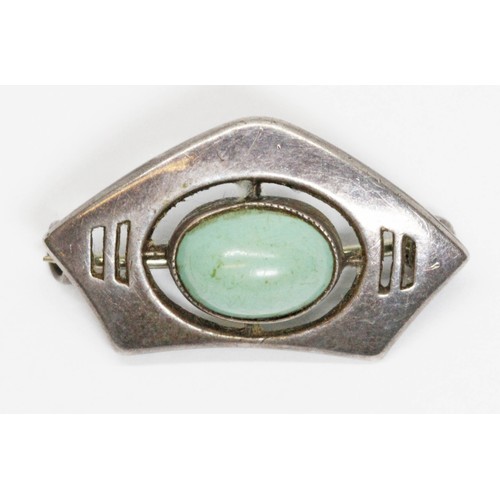 199 - A Charles Horner Arts & Crafts style silver brooch set with a green cabochon, length 25mm