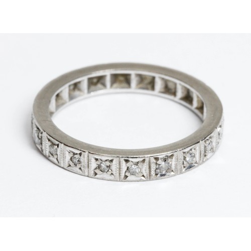 176 - A mid 20th century white metal diamond eternity ring, twenty single cut stones weighing approximatel... 