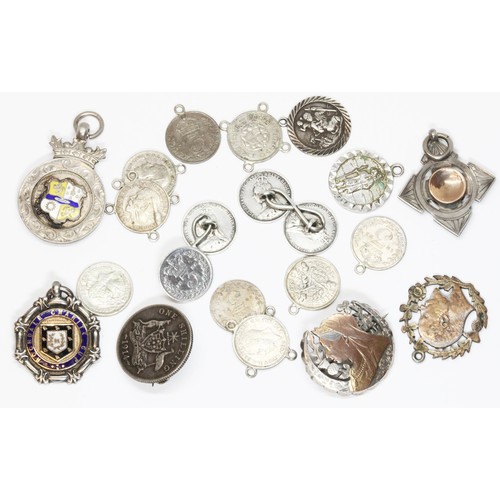 191 - A mixed lot including hallmarked silver fobs, coin brooches, and coin jewellery.