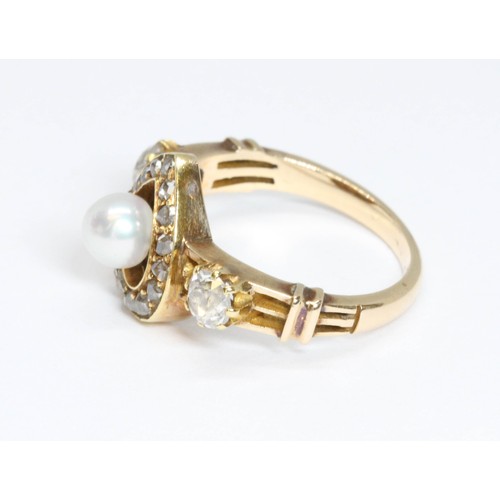 19 - An antique diamond and pearl ring, a central pearl surrounded by a heart shaped cluster of rose cut ... 