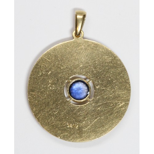 14 - A Spanish pendant, circular form bezel set with a central round mixed cut sapphire weighing approxim... 