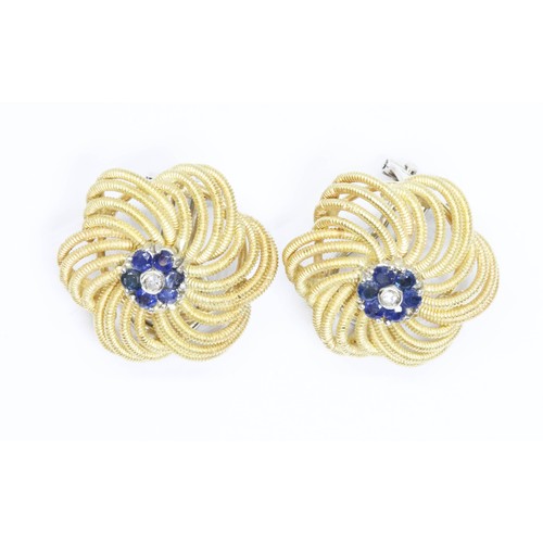 18 - A pair of sapphire and diamond earrings, flower head form with central cluster of stones, white meta... 