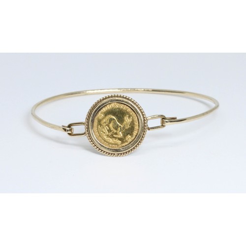 39 - A 1982 1/10th Krugerrand bangle, partial hallmark for Sheffield, diameter 5.5cm, gross weight 7.8g.