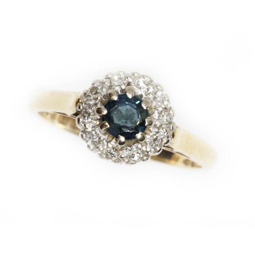 43 - A diamond and sapphire cluster ring, the central sapphire weighing approximately 0.40cts, surrounded... 