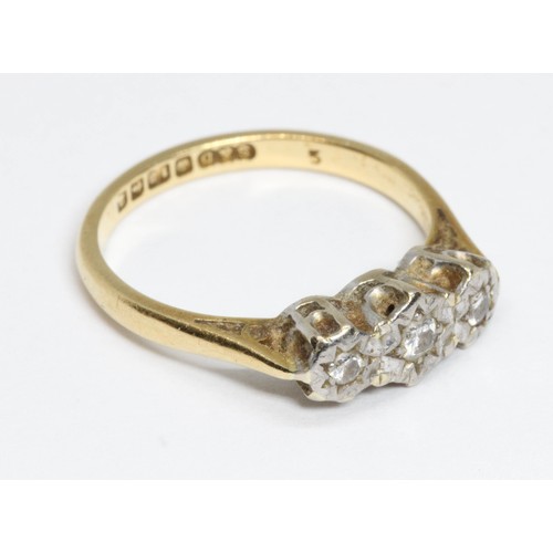 51 - A three stone diamond ring, white metal illusion setting, hallmarked 18ct yellow gold, sponsor 'S&D'... 