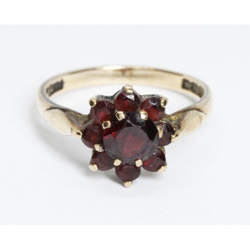 63 - A hallmarked 9ct gold garnet cluster ring, gross weight 2.7g, size L.