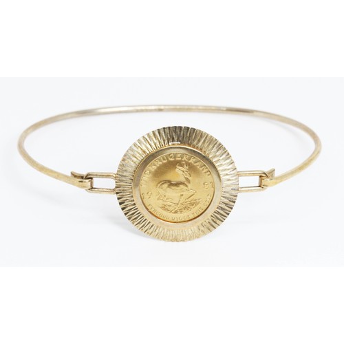 73 - A 1981 1/10th Krugerrand bangle, partial hallmarks, Sheffield, diameter 5cm, gross weight 8.3g.