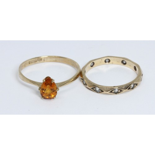 126 - A hallmarked 9ct gold ring set with a yellow stone and a colourless sonte eternity band marked '9ct'... 