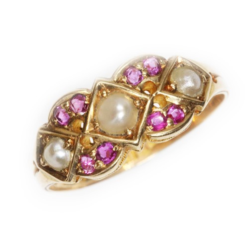 135 - A Victorian split pearl and ruby ring, hallmarked 15ct gold, sponsor 'A.A', Birminggham 1870, gross ... 