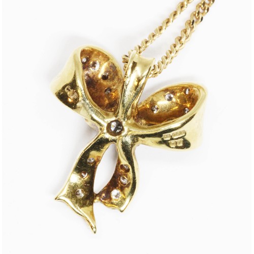 132 - CROPP & FARR, an 18ct yellow gold diamond pendant necklace, modelled as a bow and set with 21 round ... 