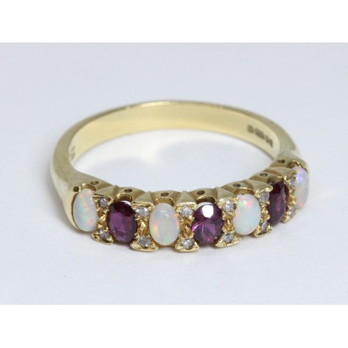 159 - An 18ct yellow gold multi-gem set half hoop ring, set with opals, rubies and diamonds, hallmarked; s... 