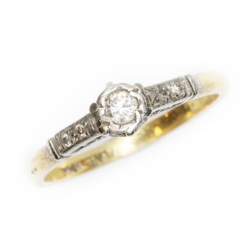 171 - A diamond solitaire ring, white metal illusion setting, diamond set shoulders, yellow band marked 'P... 