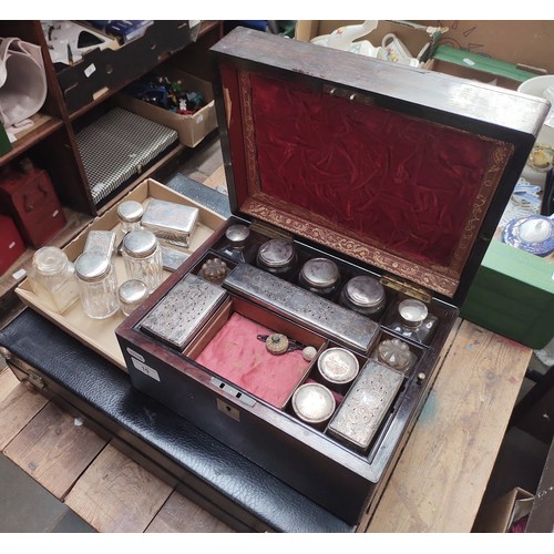 10 - A 19th century rosewood dressing box with fitted interior together with various glass containers.