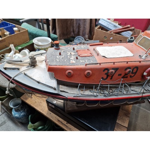 72 - A model lifeboat on stand, approx. 95cm long