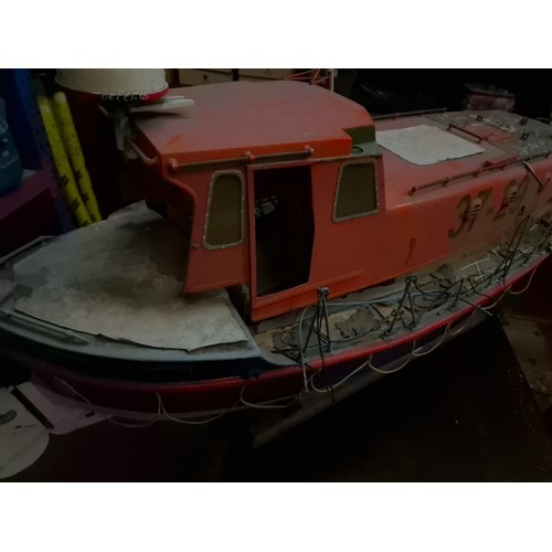 72 - A model lifeboat on stand, approx. 95cm long